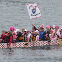 Dragon boat racers sporting pink in support of the BC Cancer Foundation.
